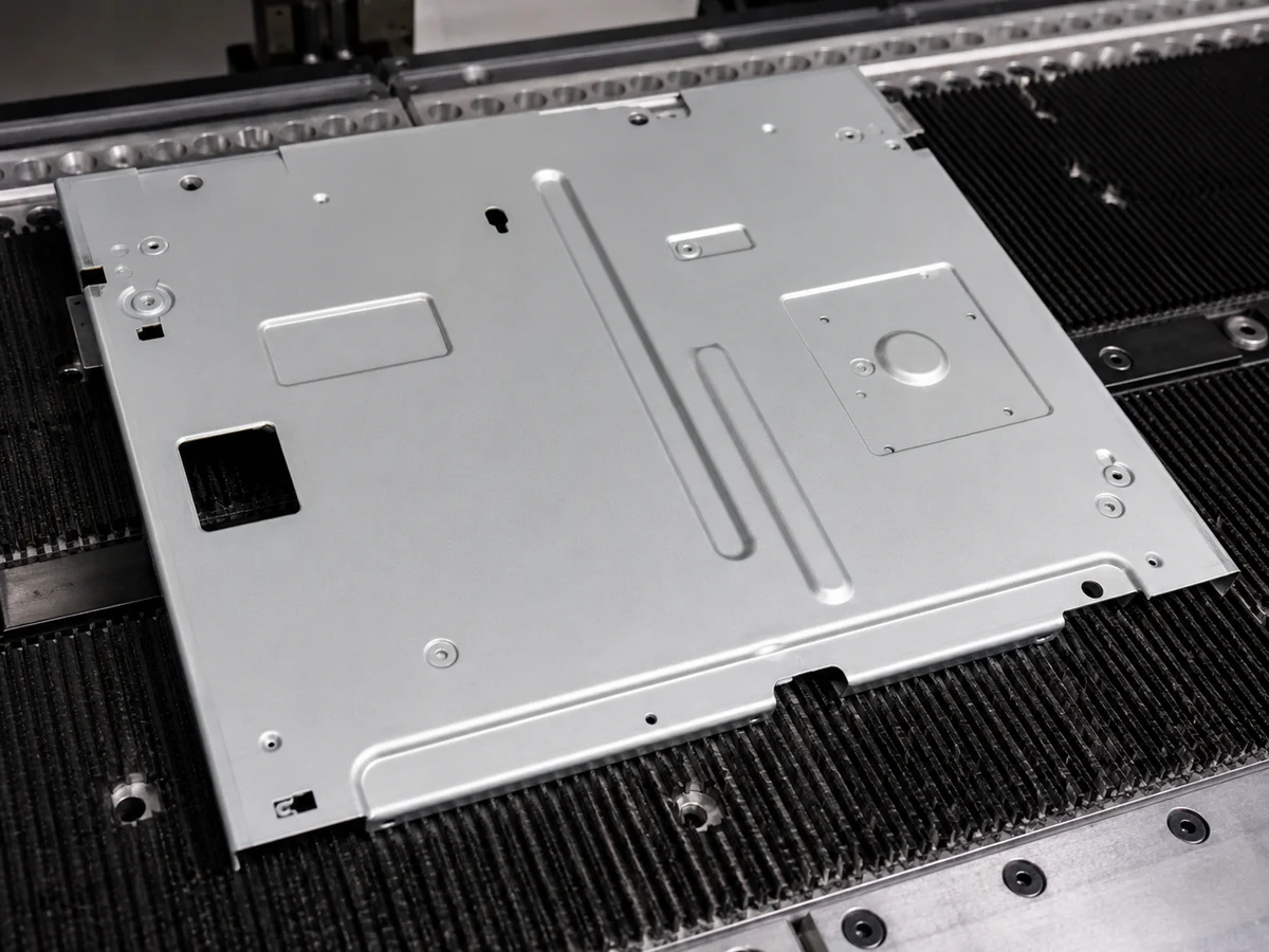 Embossed and marked details on sheet metal part
